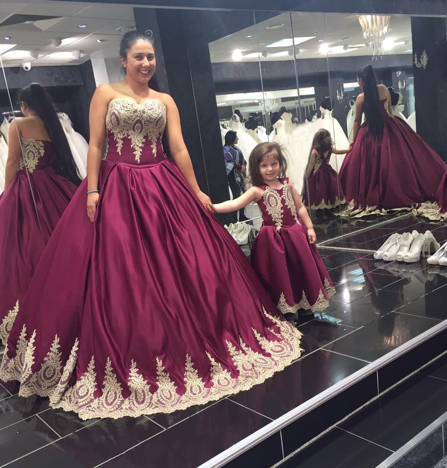 Wine red and gold hotsell quinceanera dresses